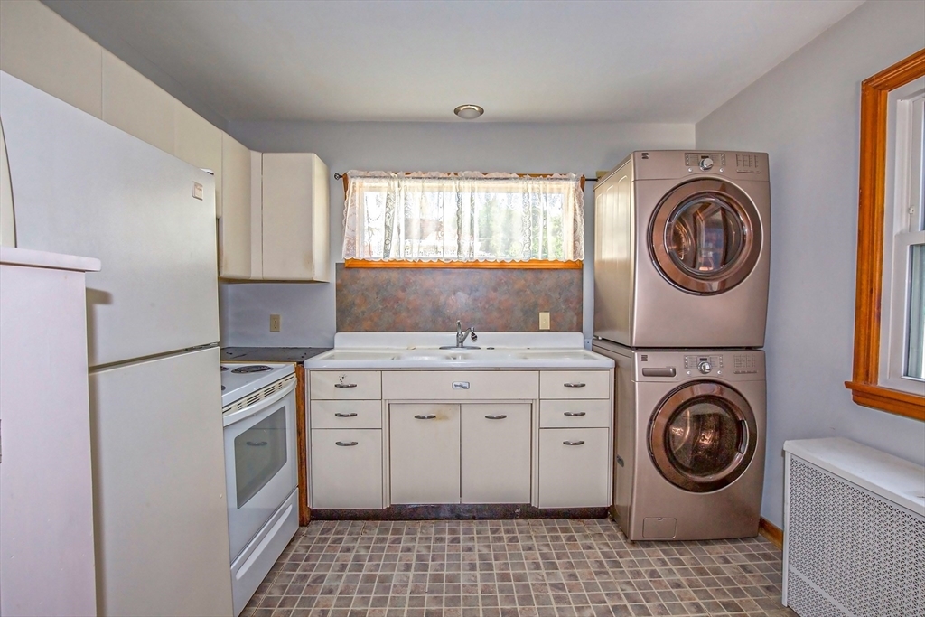 2 Admiral Street Easthampton, MA 01027 - Photo 4 of 21 a kitchen with a stove top oven sink and cabinets