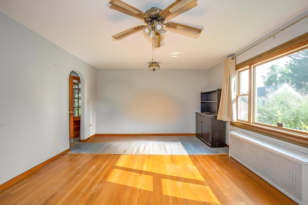 2 Admiral Street Easthampton, MA 01027 - Photo 6 of 21 a view of an empty room with a window and a ceiling fan
