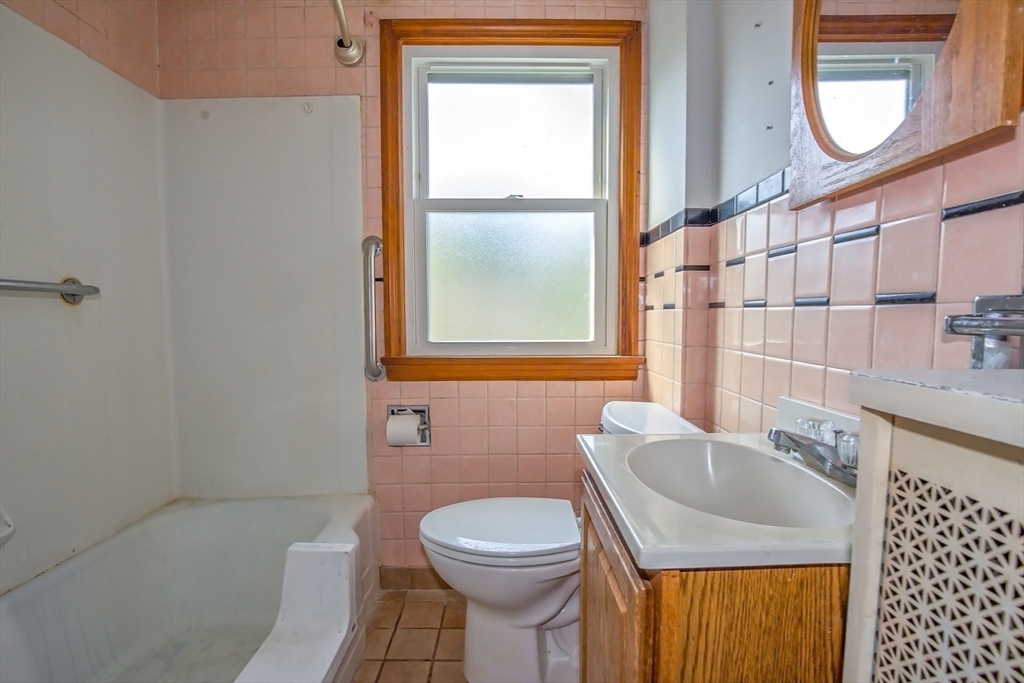 2 Admiral Street Easthampton, MA 01027 - Photo 7 of 21 a bathroom with a sink a toilet and shower