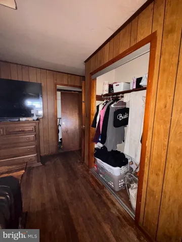 a bathroom with a toilet a sink and a mirror