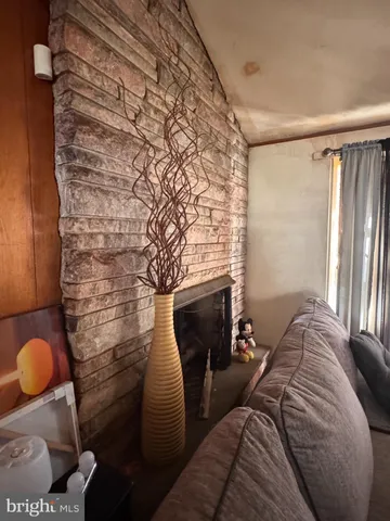 a kitchen with stainless steel appliances a sink counter top space cabinets and a window