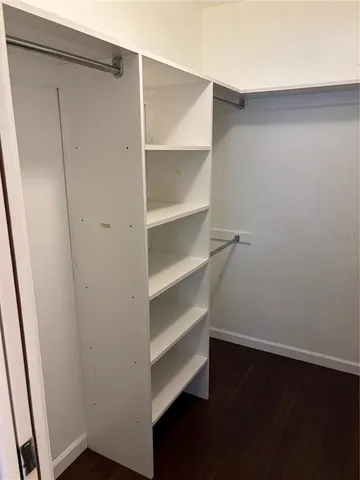 a view of an empty walk in closet