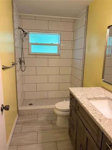 a bedroom with a bed and a table