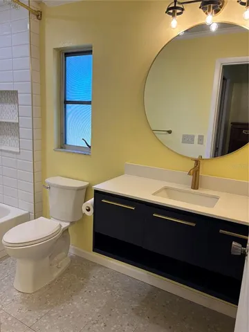 a bathroom with a toilet and shower