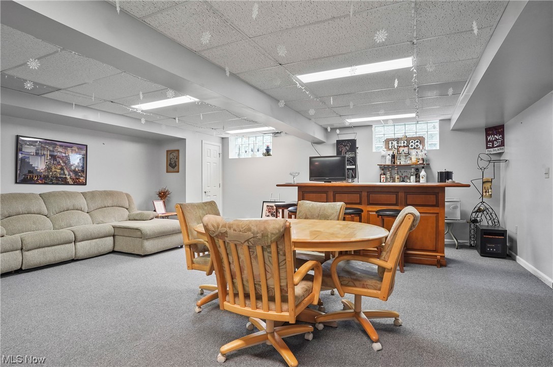 693 Timbercreek Road Northfield, OH 44067 - Photo 28 of 34 Carpeted dining room with a drop ceiling