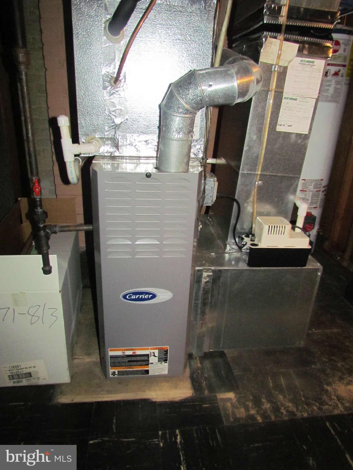 1327 Silverthorne Road Baltimore, MD 21239 - Photo 11 of 16 a picture of water heater
