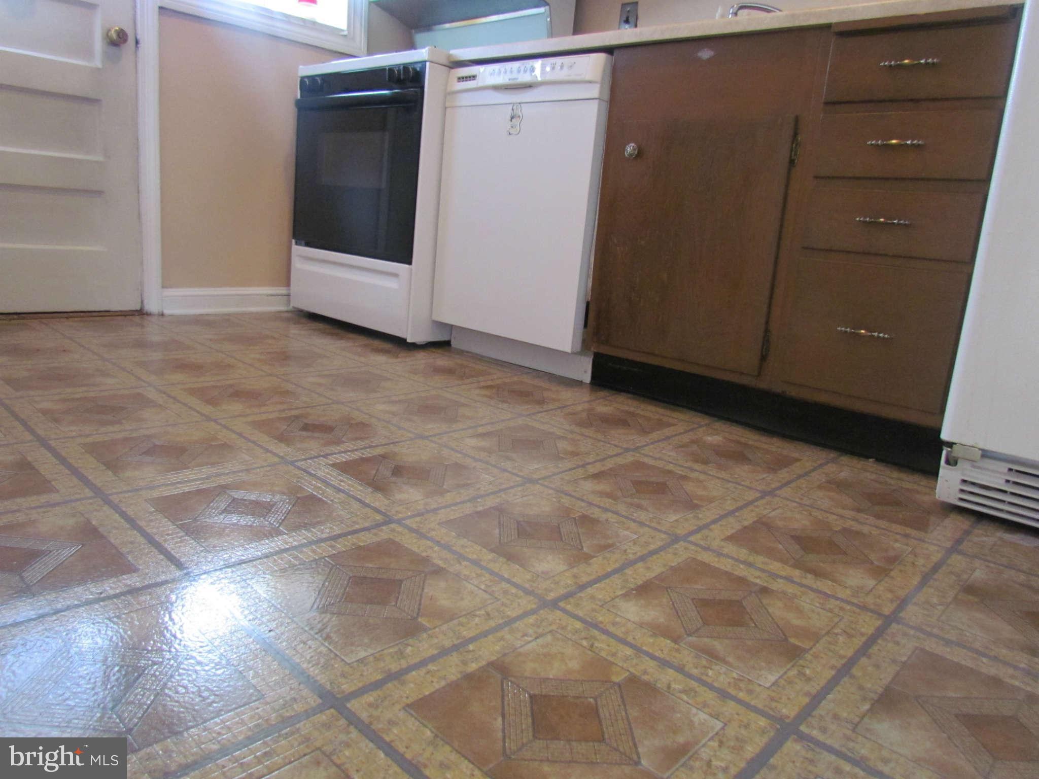 1327 Silverthorne Road Baltimore, MD 21239 - Photo 3 of 16 a view of a utility room with cabinets