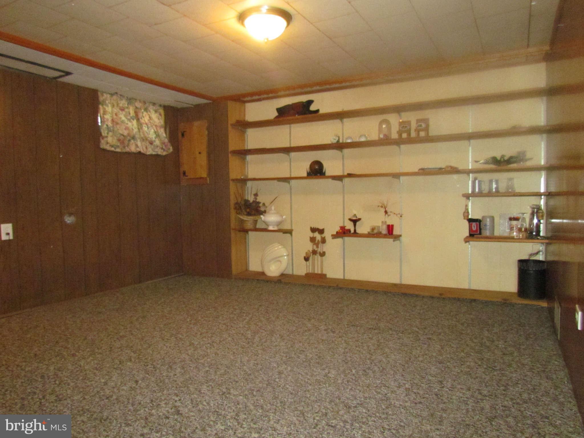 1327 Silverthorne Road Baltimore, MD 21239 - Photo 10 of 16 a view of water heater room with cabinet
