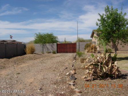 16645 West Quail Run Road Surprise, AZ 85387 - Photo 6 of 13 rv gate and road to garage in back