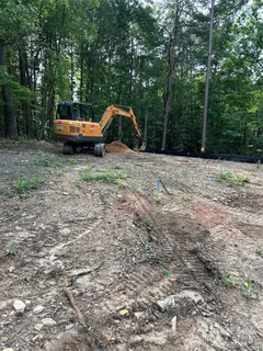 a backyard of a house with barbeque oven
