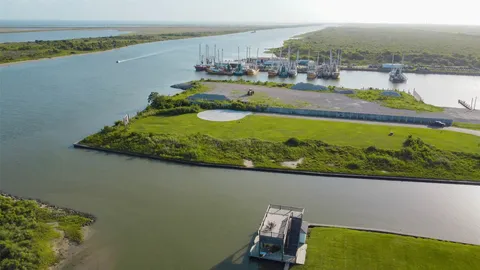 an aerial view of a city with a lake view