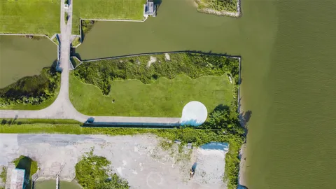 an aerial view of a house with a swimming pool