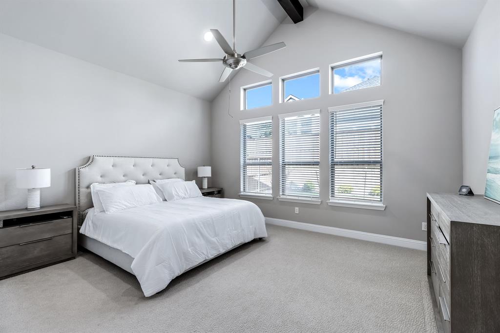 1302 Shorefront Drive Allen, TX 75013 - Photo 11 of 40 a bedroom with a bed chandelier and a window