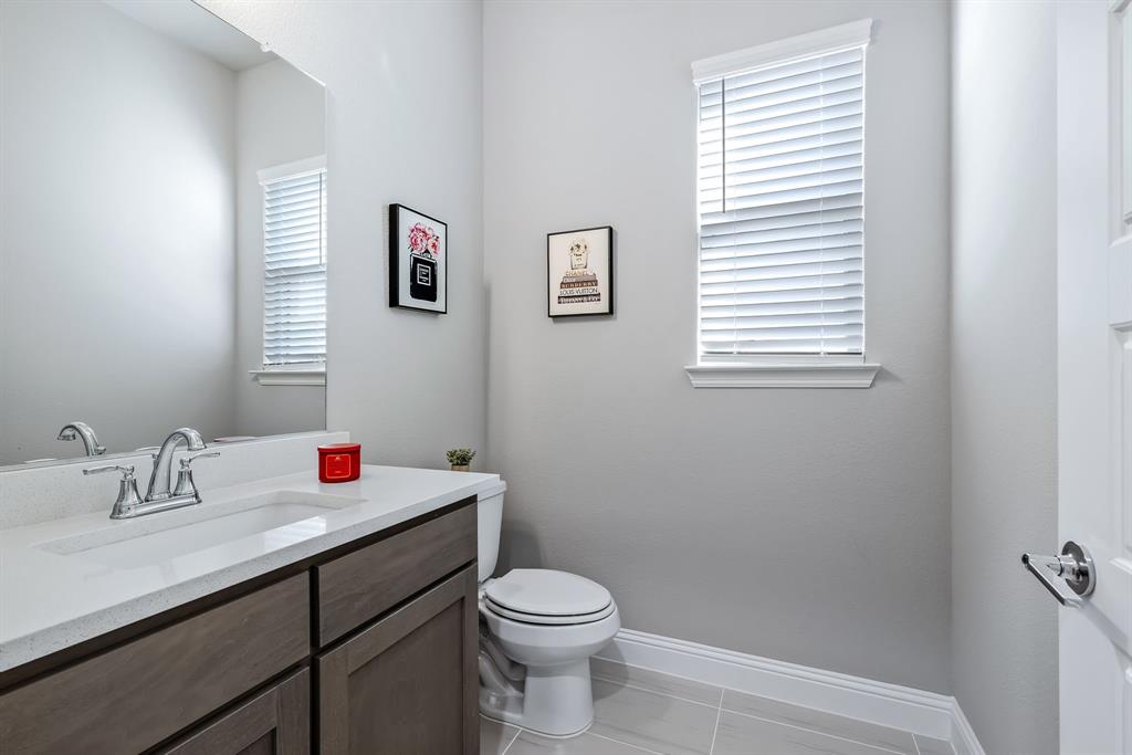 1302 Shorefront Drive Allen, TX 75013 - Photo 19 of 40 a bathroom with a sink and a toilet