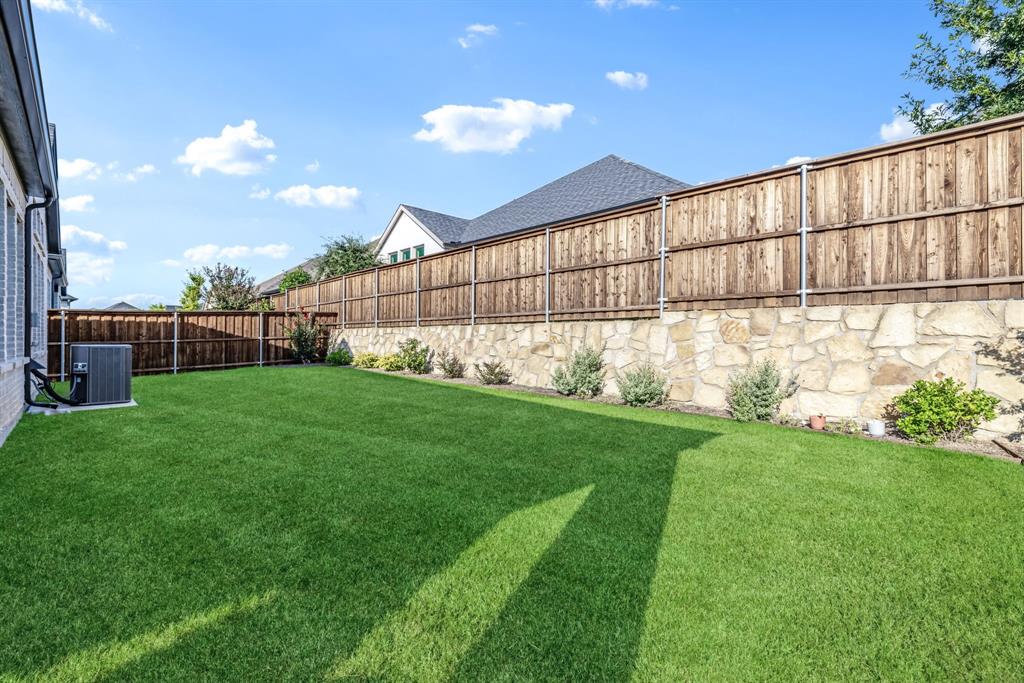 1302 Shorefront Drive Allen, TX 75013 - Photo 21 of 40 a view of yard with swimming pool and sitting area