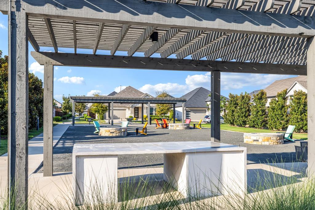 1302 Shorefront Drive Allen, TX 75013 - Photo 29 of 40 a view of a patio with a table and chairs