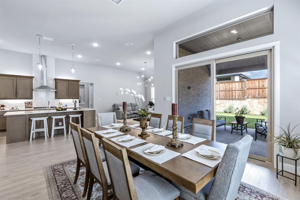 1302 Shorefront Drive Allen, TX 75013 - Photo 3 of 40 a dining room with wooden floor a sink and kitchen view