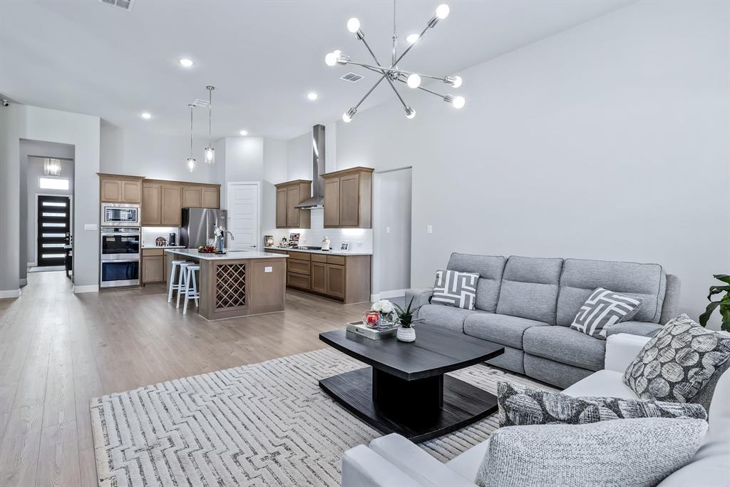 1302 Shorefront Drive Allen, TX 75013 - Photo 9 of 40 a living room with furniture and kitchen view