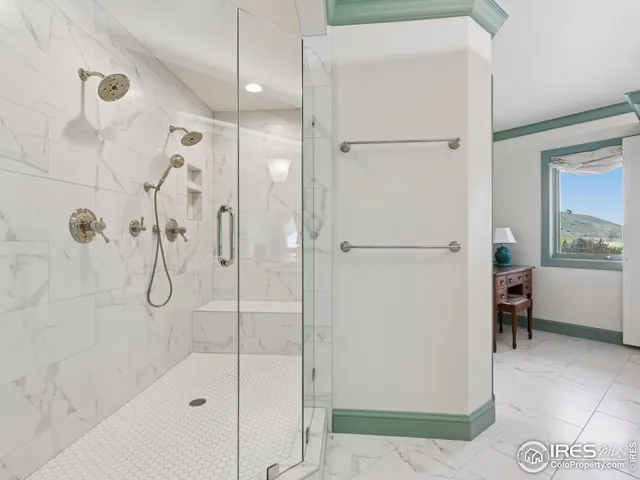 a bathroom with a glass shower door