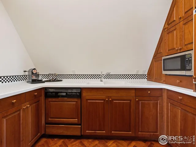 a kitchen with a sink and cabinets