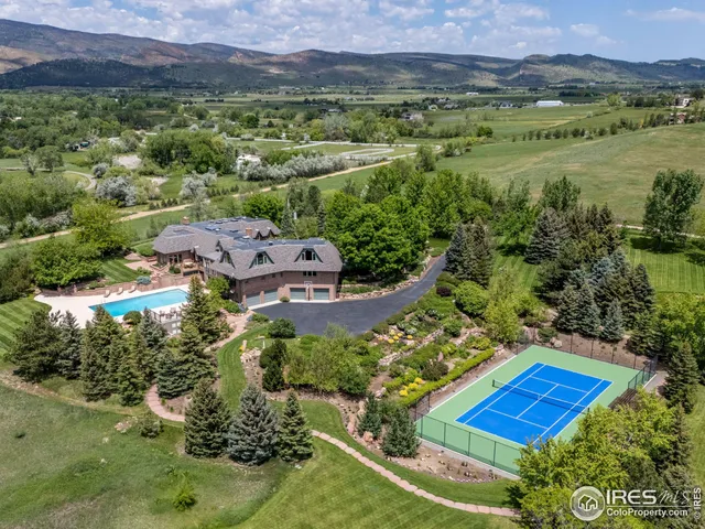 an aerial view of residential houses with outdoor space and street view