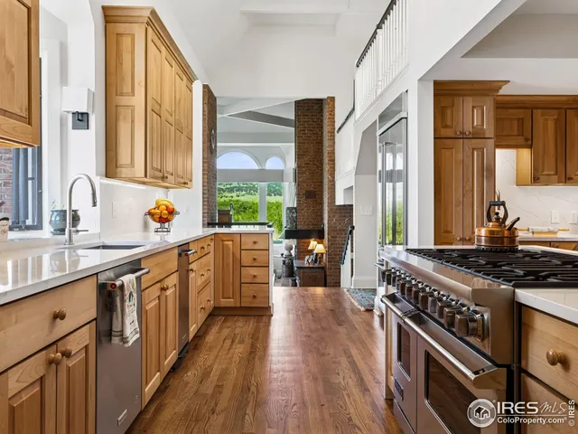 a kitchen with stainless steel appliances a stove sink and cabinets