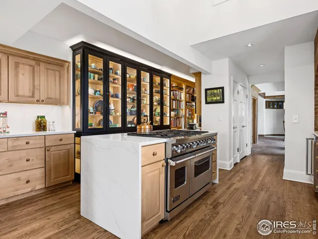 a kitchen with a stove top oven and sink