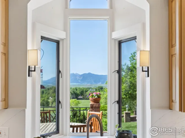 a view of a glass door and a window