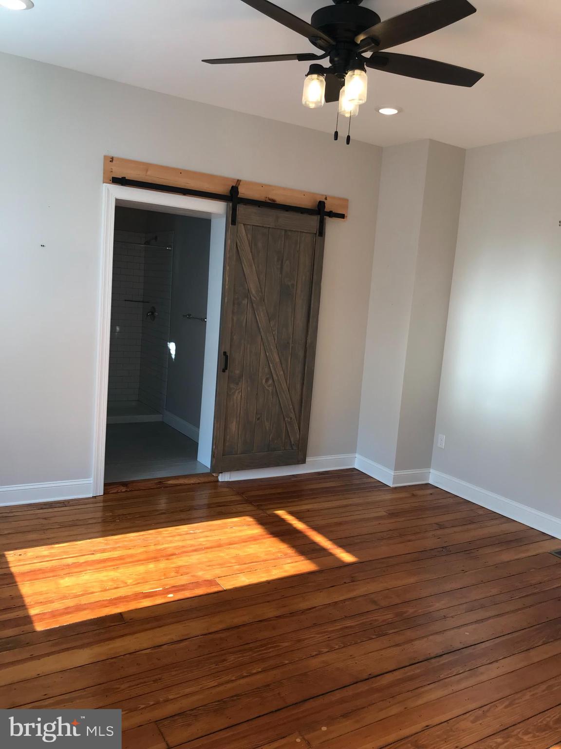 15 A Potter Street Haddonfield, NJ 08033 - Photo 8 of 11 an empty room with wooden floor and fan