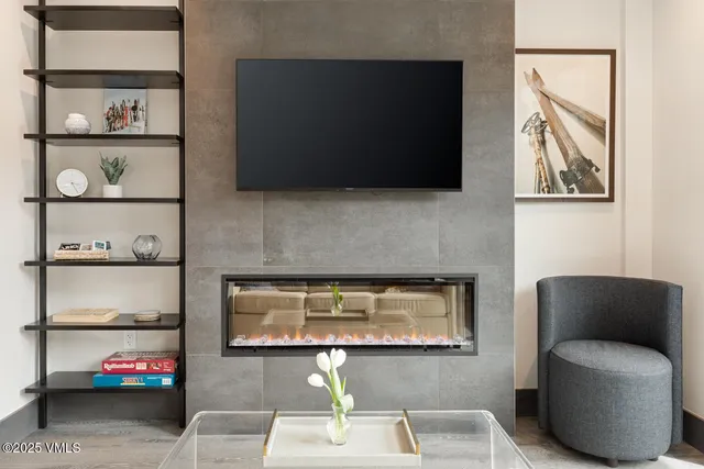 a living room with furniture and flat screen tv