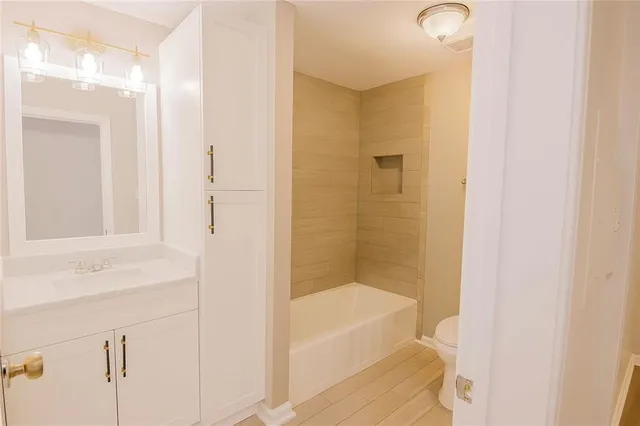 a bathroom with a bathtub and a sink