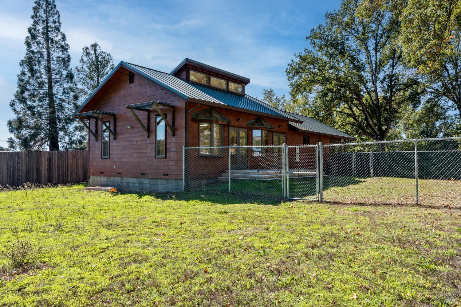 10185 East Road Redwood Valley, CA 95470 - Photo 14 of 17 a view of a house with a yard