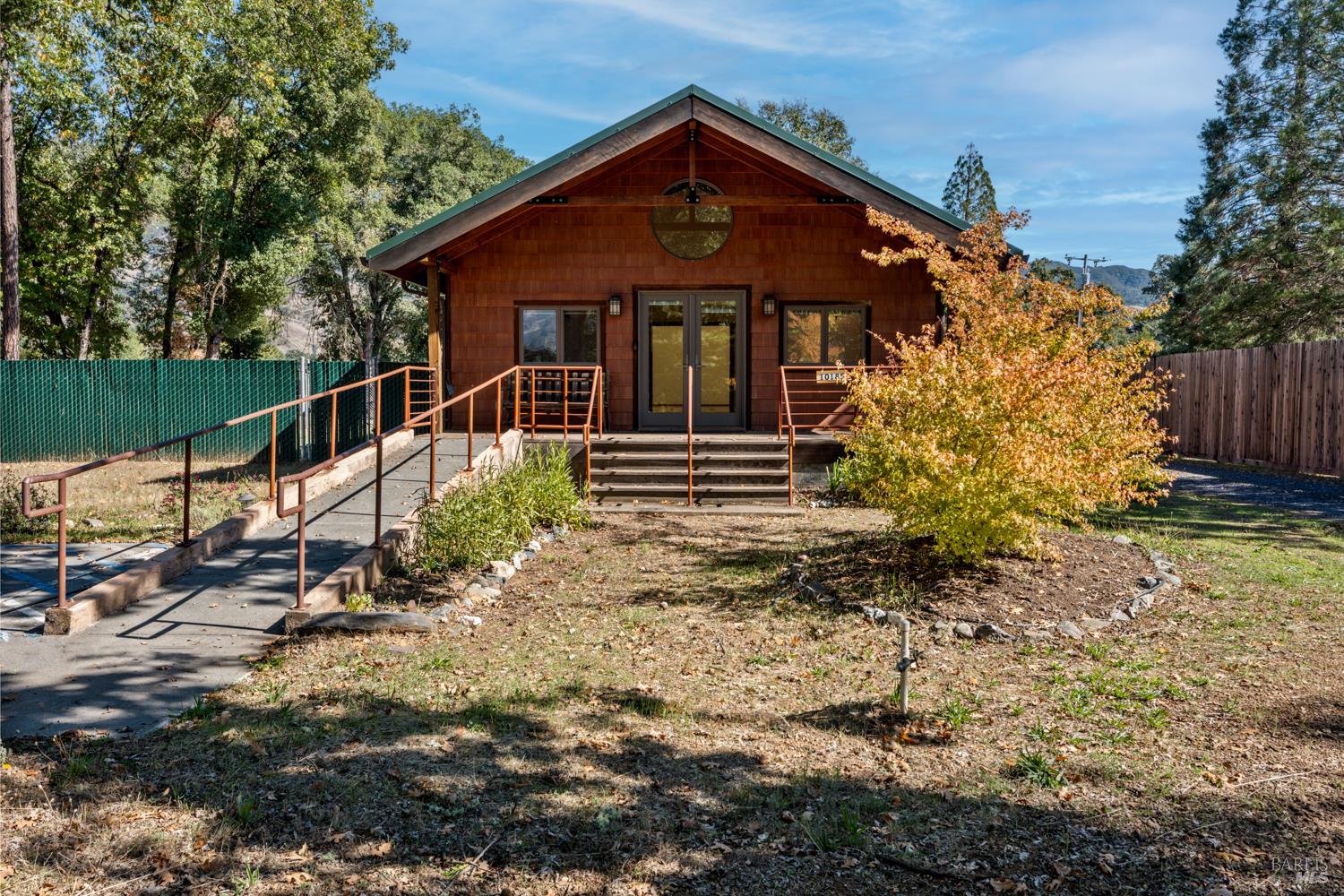 10185 East Road Redwood Valley, CA 95470 - Photo 2 of 17 a front view of a house with garden
