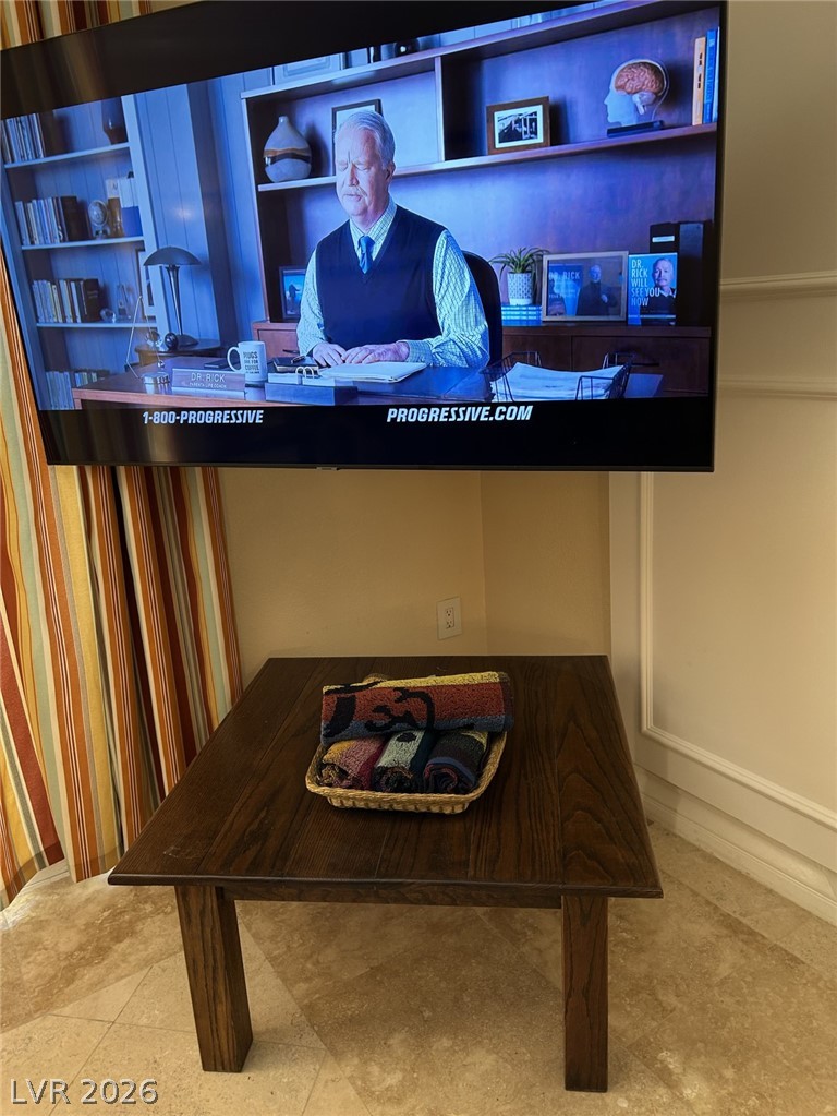 210 East Flamingo Road, Unit 137 Las Vegas, NV 89169 - Photo 16 of 32 Entertainment hub with ample space, perfect for cozy gatherings and movie nights.