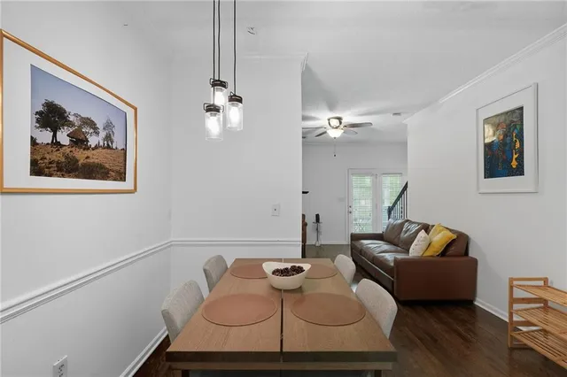 a living room with furniture flowerpot and window
