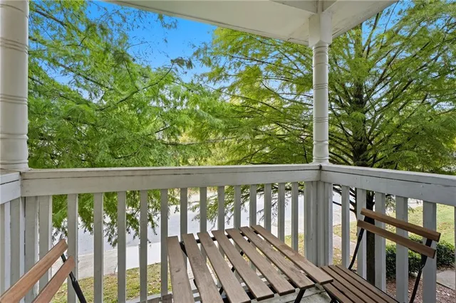 a view of a balcony with wooden floor
