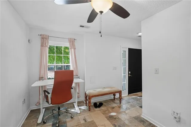 a work room with furniture and a window