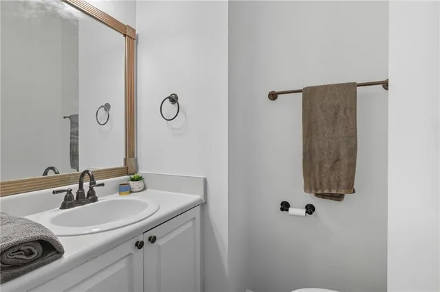 a bathroom with a sink and mirror