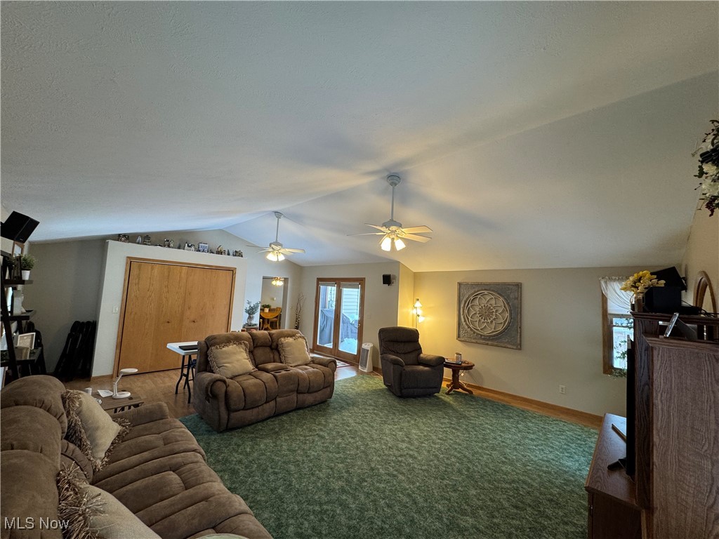 Great room with carpet floors and baseboards