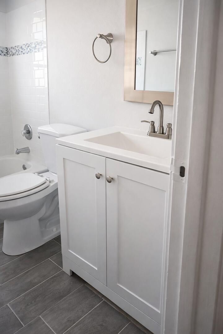 541 Northeast 48th Street, Unit 205 Boca Raton, FL 33431 - Photo 5 of 8 a bathroom with a sink and a toilet