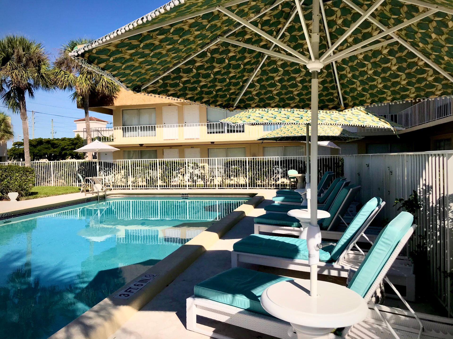 541 Northeast 48th Street, Unit 205 Boca Raton, FL 33431 - Photo 8 of 8 a view of a chairs and table in patio