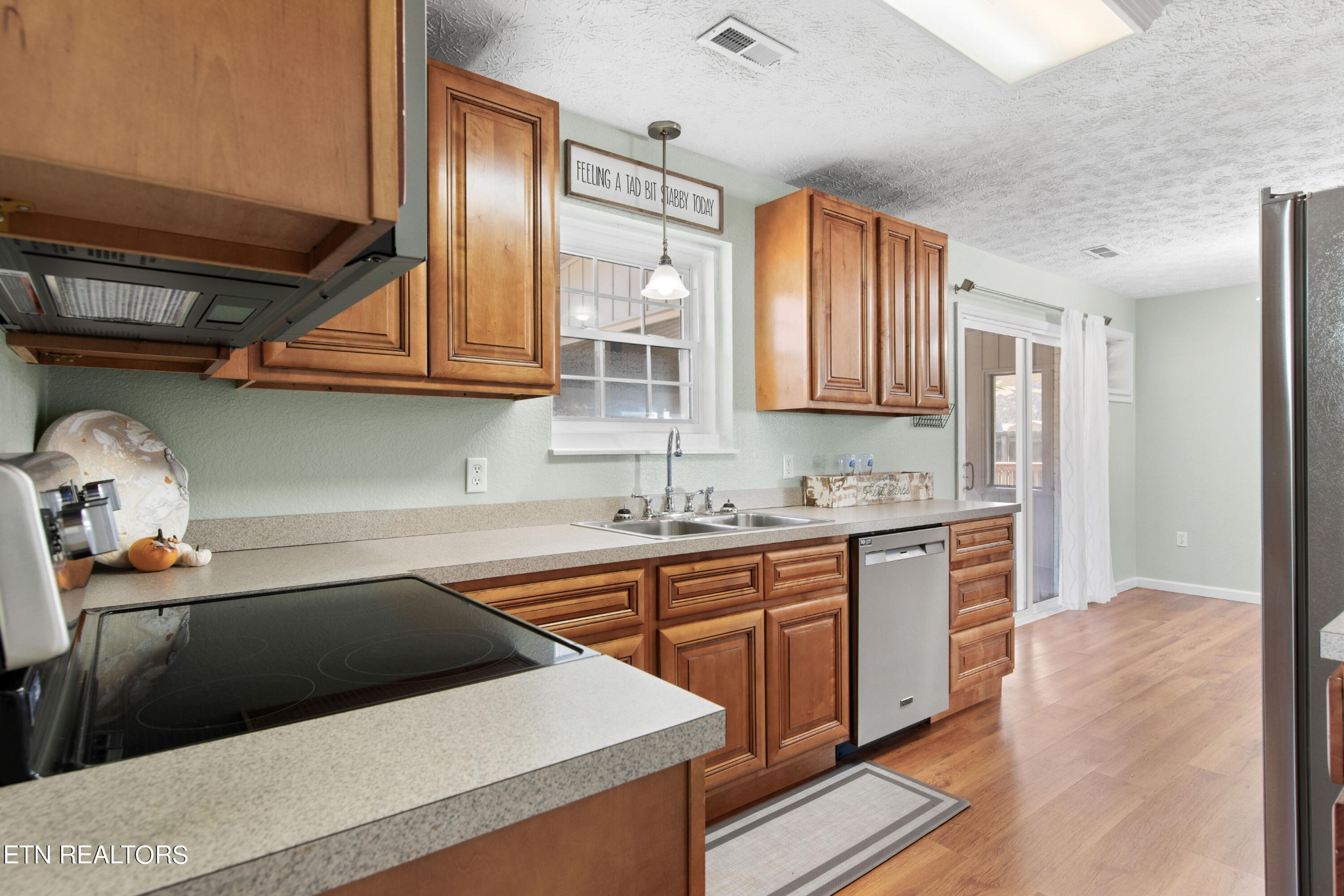 2252 Shinbone Road Sevierville, TN 37876 - Photo 12 of 27 a kitchen that has a sink and a stove in it