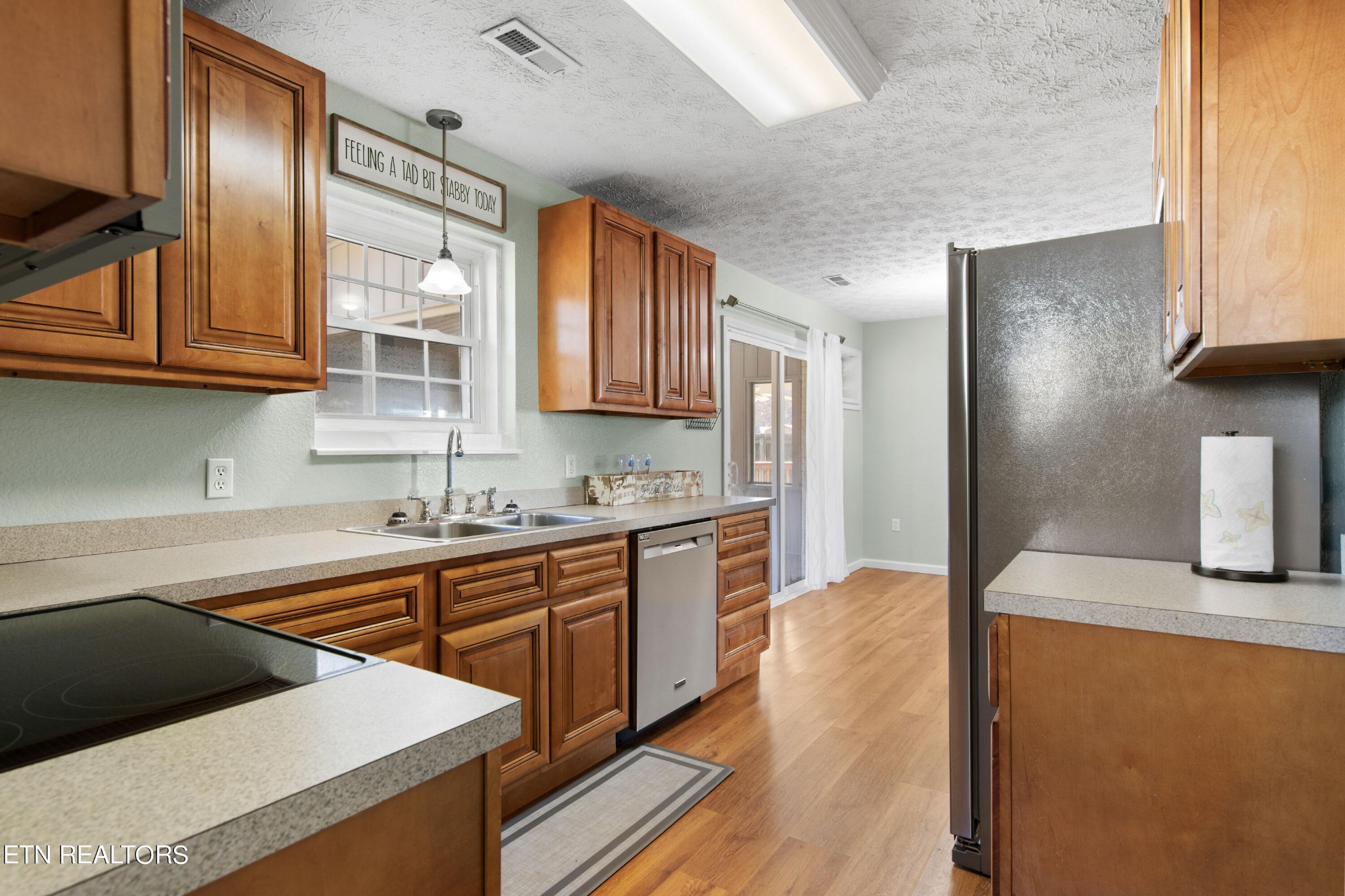 2252 Shinbone Road Sevierville, TN 37876 - Photo 13 of 27 a kitchen with stainless steel appliances granite countertop a sink a stove and a refrigerator