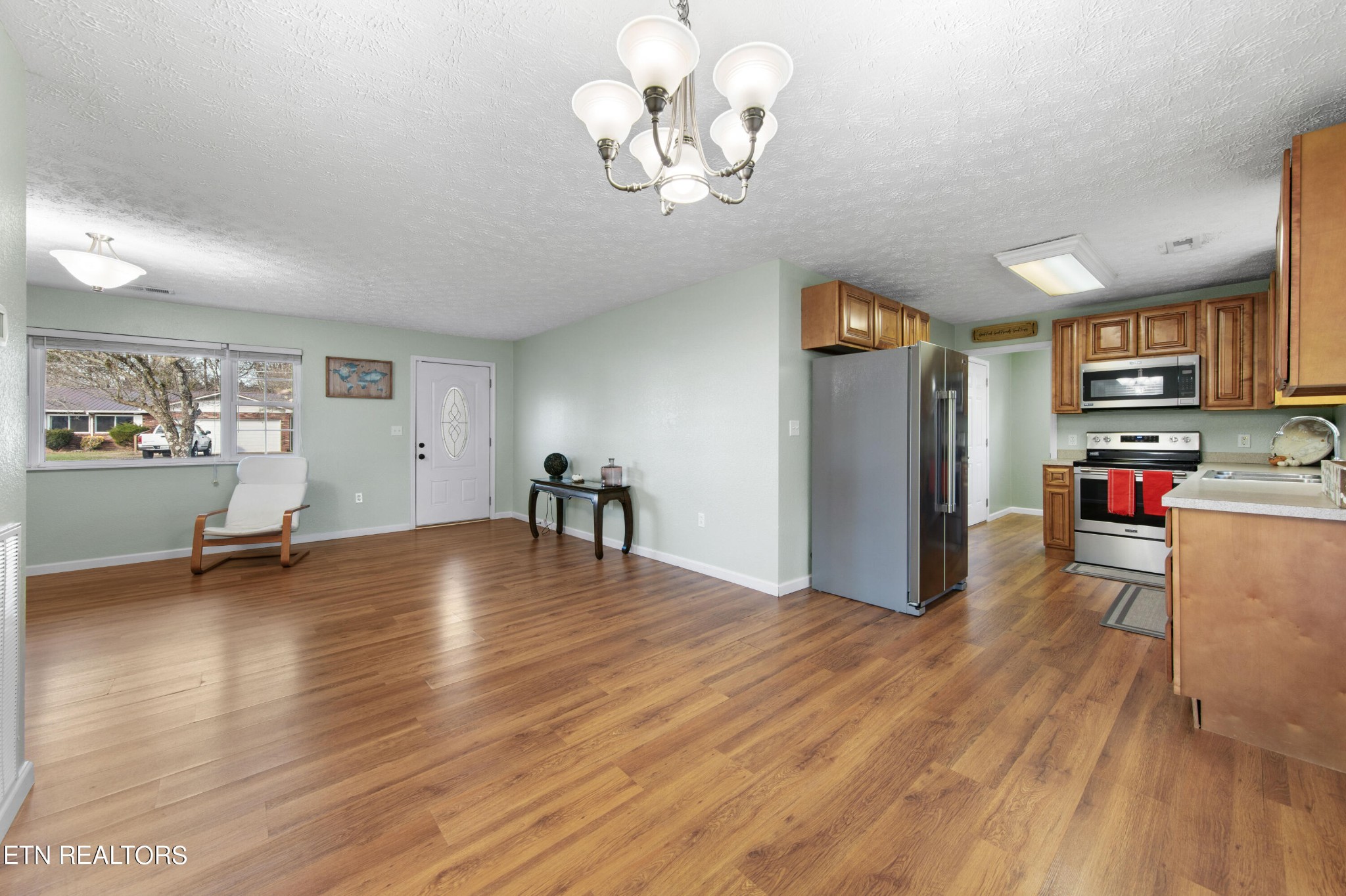 2252 Shinbone Road Sevierville, TN 37876 - Photo 6 of 27 a view of livingroom with kitchen island furniture and wooden floor