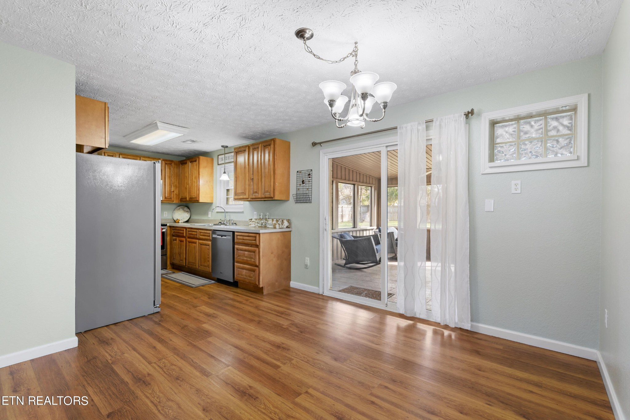 2252 Shinbone Road Sevierville, TN 37876 - Photo 9 of 27 a view of a kitchen with a sink and refrigerator