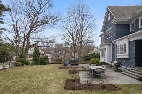 a view of a patio with couches and a fire pit