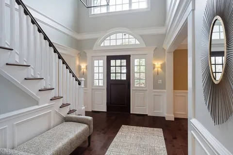 a view of an entryway with wooden floor