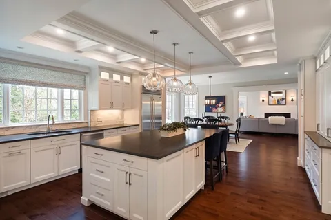 a kitchen with sink stove and cabinets
