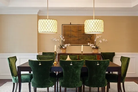 a view of a dining room with furniture and chandelier