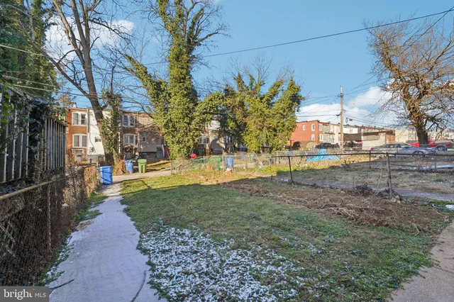 a view of a street with houses on both side